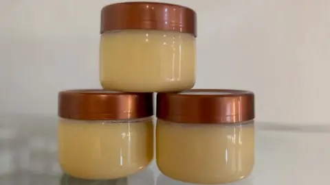 Three containers containing shea butter from Uganda