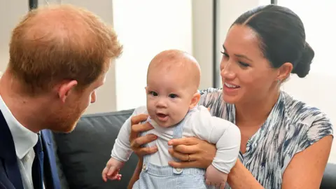 PA Media The Duke and Duchess of Sussex with their first child, Archie