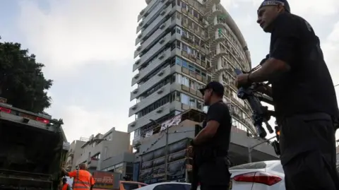 Police at the site of a drone strike in Tel Aviv.