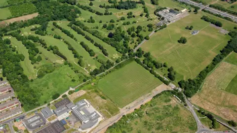 Historic England Archive A recent oblique aerial photograph of Belhus Park. The site of the former Belhus manor house is located west of the leisure centre.