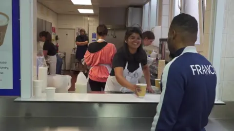 Whitechapel mission girl serves drink