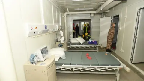 EPA Military medical staff inspect rooms at new hospital - 2 February