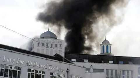 PA The mosque's administration building on fire on 26 September 2015