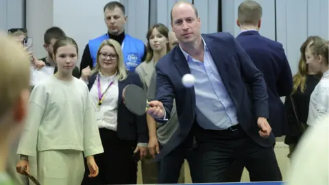 PA Media Prince William plays table tennis