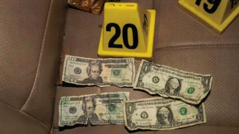 Hennepin County District Court A picture of fake dollar bills found in Mr Floyd's car, according to court documents