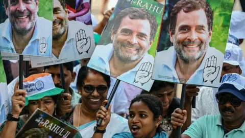 Getty Images Supporters of the "India" coalition with placards bearing the face of opposition politician Rahul Gandhi