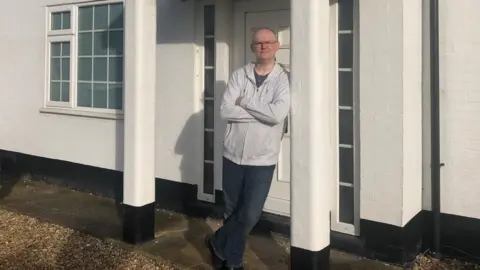 Paul Brett Paul Brett outside his house