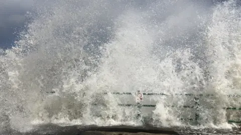 BBC Water breaking over pier