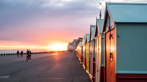 Getty Images Beach Huts during sunset at Brighton and Hove, England