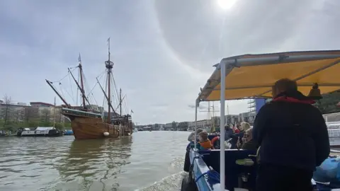 Michael Sergison A Bristol Ferry boat passes The Matthew on Bristol's Floating Harbour