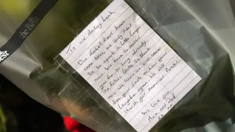 Joe Giddens/PA Wire Note left by Leah Croucher's mother and father