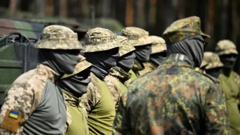 Reuters Ukrainian soldiers stand at attention