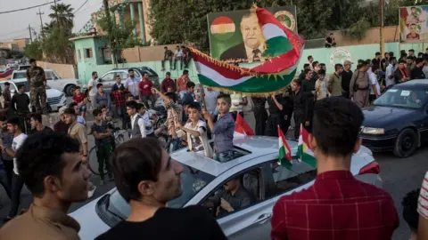 Getty Images Kurds celebrate on the streets of Kirkuk after voting in an independence referendum on 25 September 2017