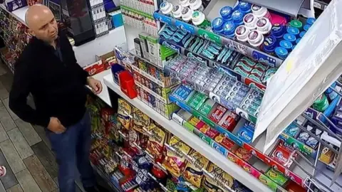 Essex Police Gheorghe Nica in a shop