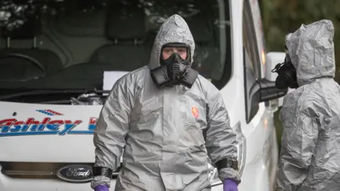 Getty Images Investigators in protective clothing remove a van from an address in Winterslow near Salisbury, as police and members of the armed forces continue to investigate the suspected nerve agent attack on Russian double agent Sergei Skripal on March 12, 2018