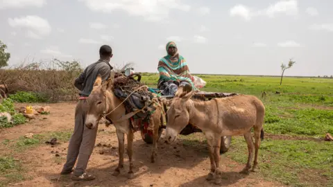 Kate Stanworth Farmers with donkey on the site of the former refugee camp at Hartisheik, Ethiopia
