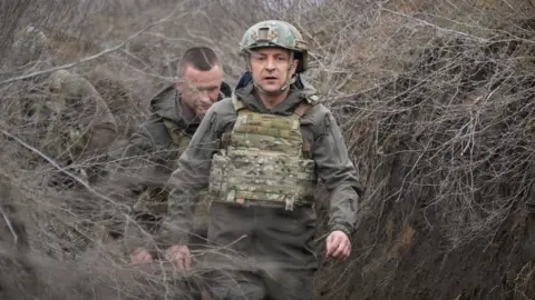 EPA Ukrainian President Volodymyr Zelensky on a working visit to the eastern Ukrainian conflict zone, 09 April 2021