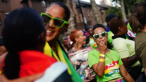 Victoria Jones/PA Wire Notting Hill Carnival goers