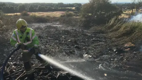 TWFRS Firefighter at the scene of a wildfire in Easington Lane