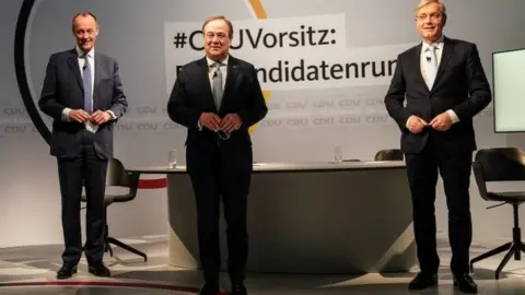 EPA (L-R) Friedrich Merz, Armin Laschet, and Norbert Röttgen