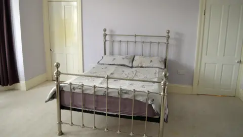 The bed now in Mrs Lowry's old bedroom