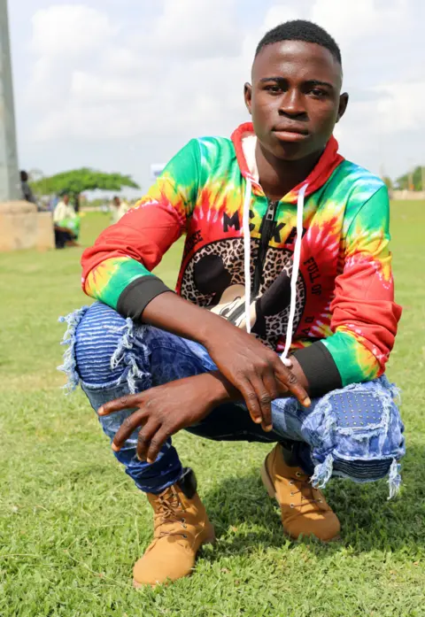 BBC A boy in colourful shirt