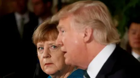 Reuters German Chancellor Angela Merkel and US President Donald Trump hold a joint news conference in the White House in Washington, 17 March 2017