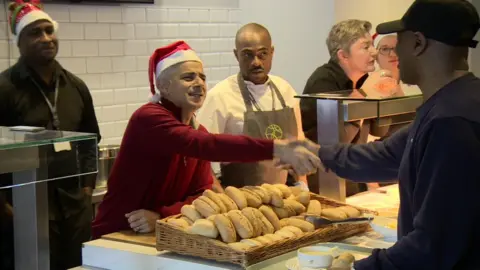 BBC Sadiq Khan hands out food