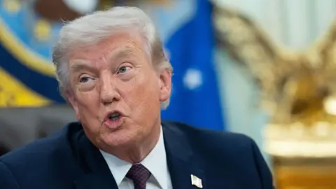 Getty Images US President Donald Trump speaks from the Oval Office