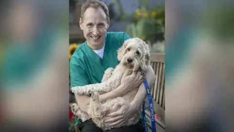 Roger Allen David Anderson and Jasper the cockapoo