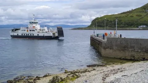 Getty Images Calmac car ferry - Caledonian MacBrayne vehicle ferries - arriving at Lochranza Ferry Port, Isle of Arran, Scotland.