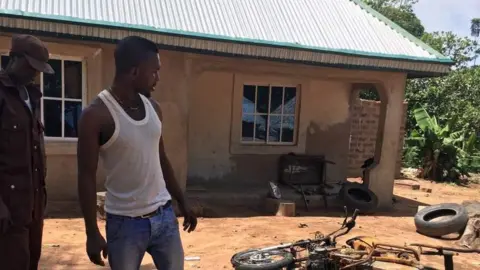 Alamy Burnt bike in Mbalom