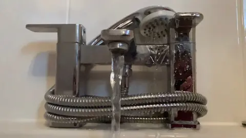 Martin Heath/BBC A mixer tap with water flowing