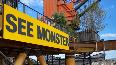 See Monster sign