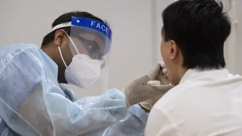 Victoria Jones A member of the public being tested for coronavirus