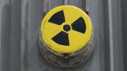 Getty Images A symbol for radioactivity on a radioactively-contaminated container once used to transport nuclear fuel rods