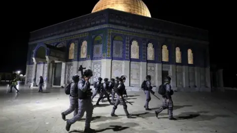 Reuters Israeli police walk near the Dome of the Rock during clashes with Palestinians, 7 May