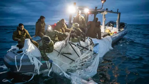 Tyler Thompson/US Navy US Navy recover the debris of a high-altitude surveillance balloon off the coast of Myrtle Beach, South Carolina, Feb. 5, 2023.