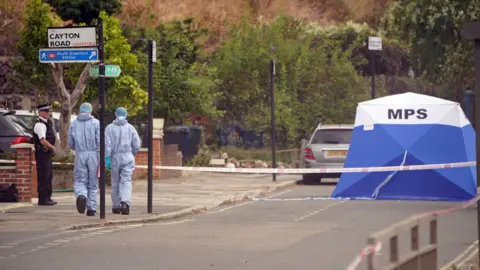 PA Media Forensic officers at the scene near to Cayton Road