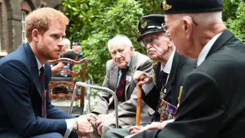 Getty Images Prince Harry meeting a veteran at the premiere