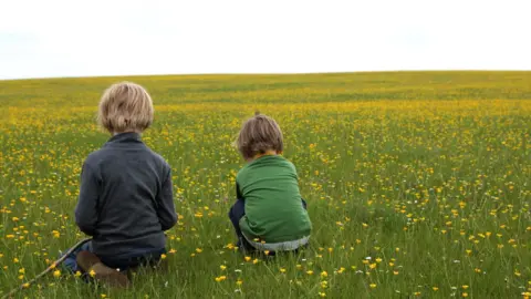 Getty Images Children in field
