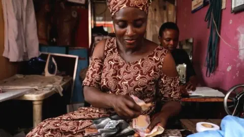 Reuters Woman with money