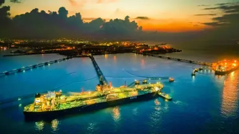 Getty Images An oil tanker loads off oil at the reception terminal in Qingdao in east China's Shandong province.