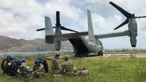 Paul Blake/BBC USMC Osprey drops supplies for British soldiers in the British Virgin Islands