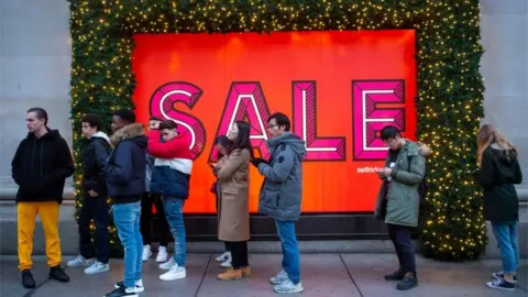 Getty Images People queuing for Selfridges sales