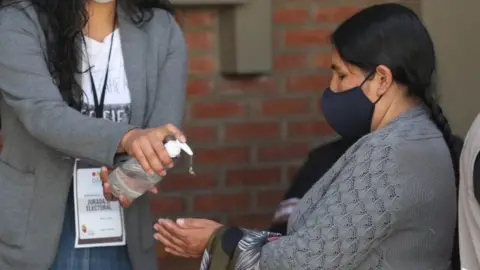 EPA Citizens participate in a mock voting with biosafety measures, in La Paz, Bolivia, 09 October 2020 (issued 12 October).