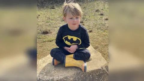 AFP Hugh Menai-Davis sitting on a rock