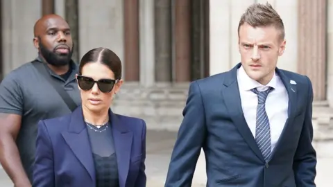 PA Media Rebekah and Jamie Vardy leaving the Royal Courts of Justice.