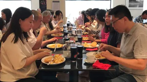 Chinese visitors to Scotts Fish and Chips