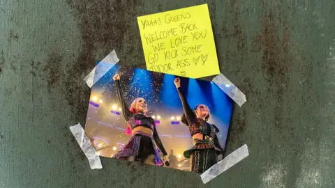 Getty Images A note and picture stuck to the door of the Lyric Theatre in London ahead of Six's return